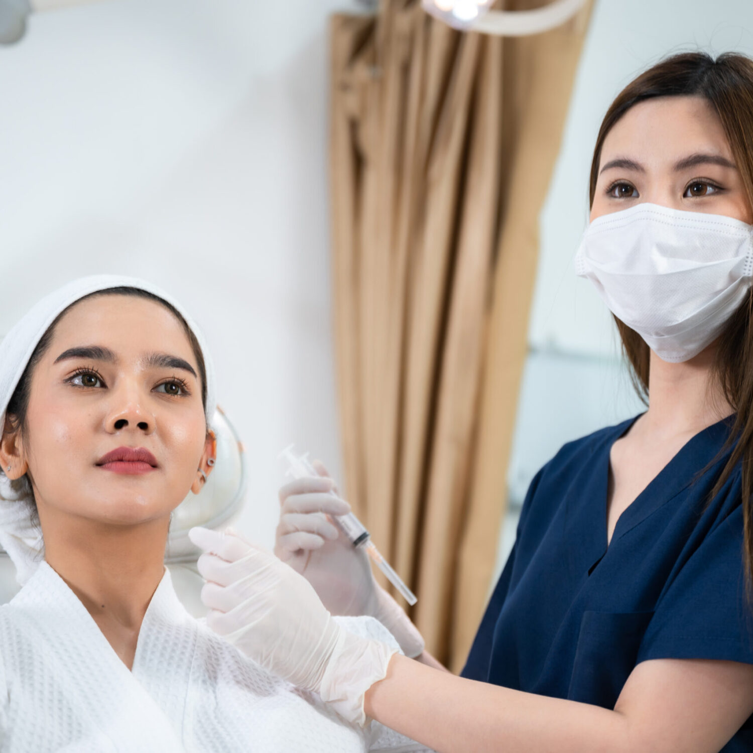 young Asian woman making cosmetology treatment skin injection, Mesotherapy of face beauty care